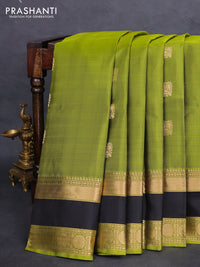 Pure soft silk saree light green and black with annam zari woven buttas and rettapet zari woven border