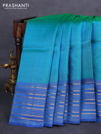 Pure soft silk saree dual shade of teal green and cs blue with allover zari weaves and zari woven border