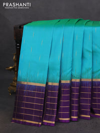 Pure soft silk saree teal green and violet with zari woven buttas and zari woven checked border