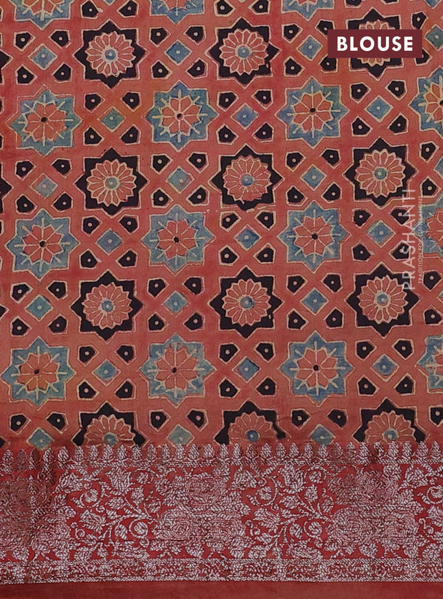 Chiniya silk saree dark green and rust shade with plain body and woven border