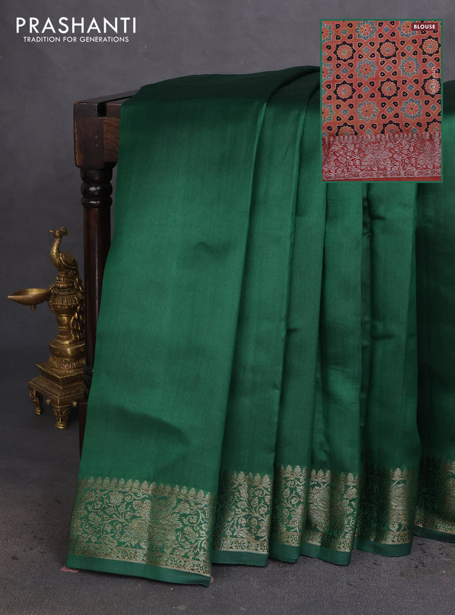 Chiniya silk saree dark green and rust shade with plain body and woven border