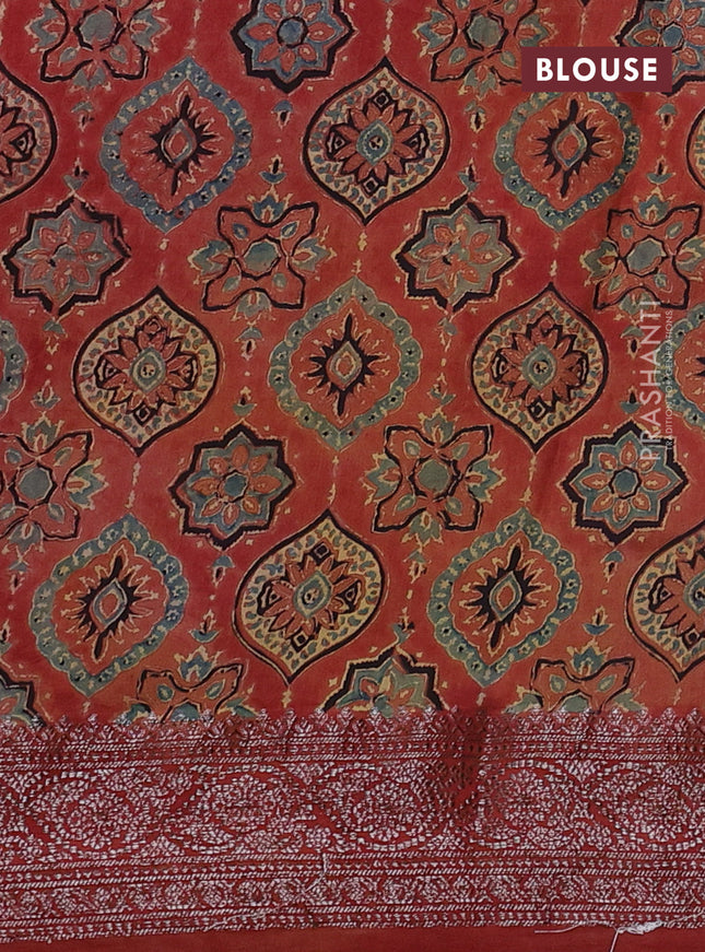 Chiniya silk saree dark mustard and rust shade with plain body and woven border