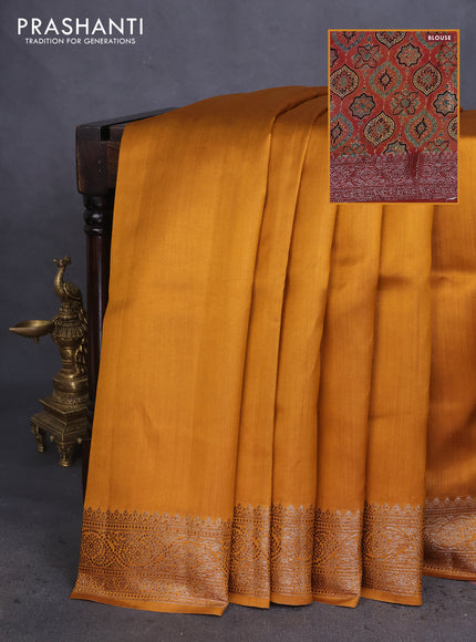 Chiniya silk saree dark mustard and rust shade with plain body and woven border