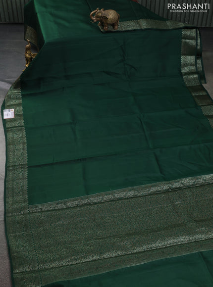 Chiniya silk saree dark green and rust shade with plain body and woven border