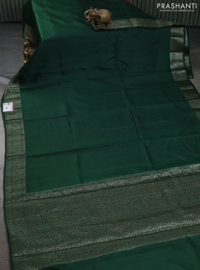 Chiniya silk saree dark green and rust shade with plain body and woven border