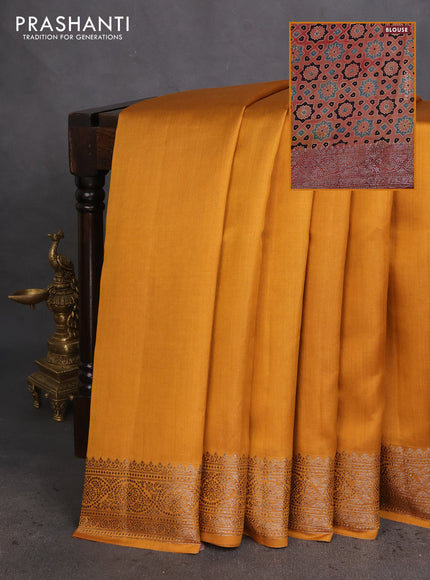 Chiniya silk saree dark mustard and rust shade with plain body and woven border