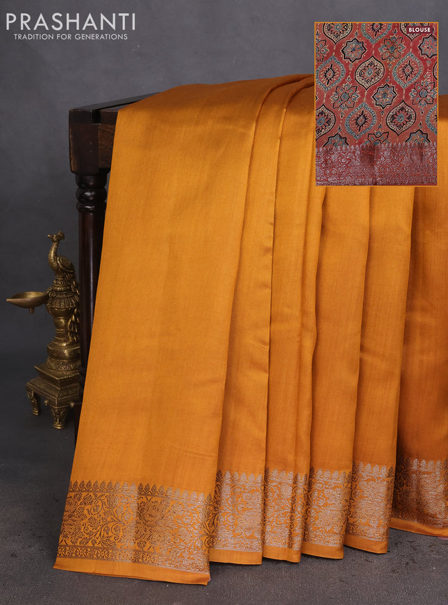 Chiniya silk saree dark mustard and rust shade with plain body and woven border