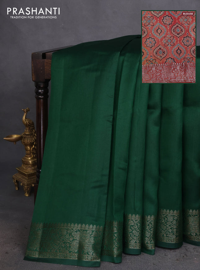 Chiniya silk saree green and rust shade with plain body and woven border