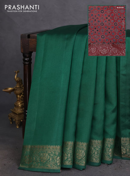 Chiniya silk saree green and maroon with plain body and woven border