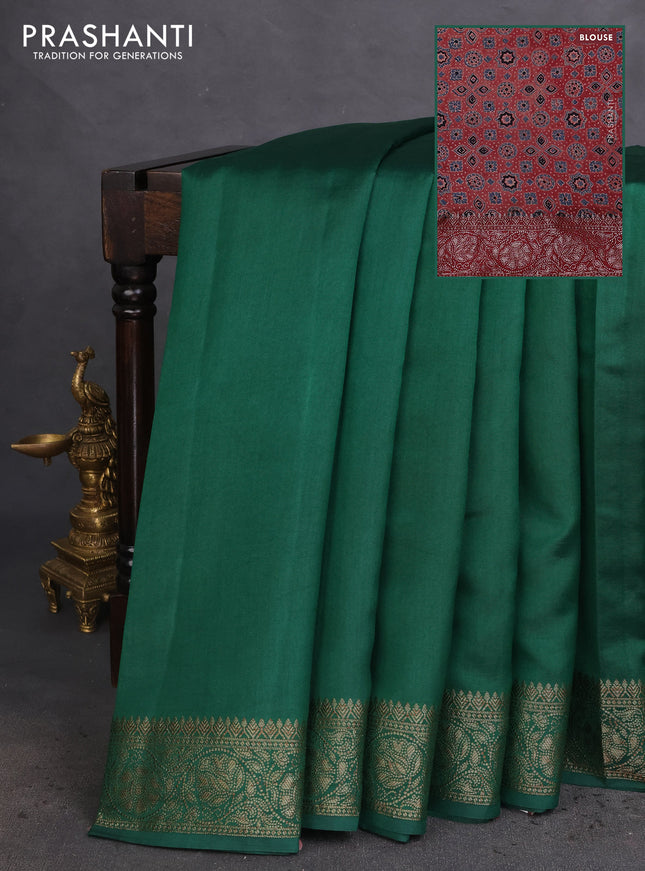 Chiniya silk saree green and maroon with plain body and woven border