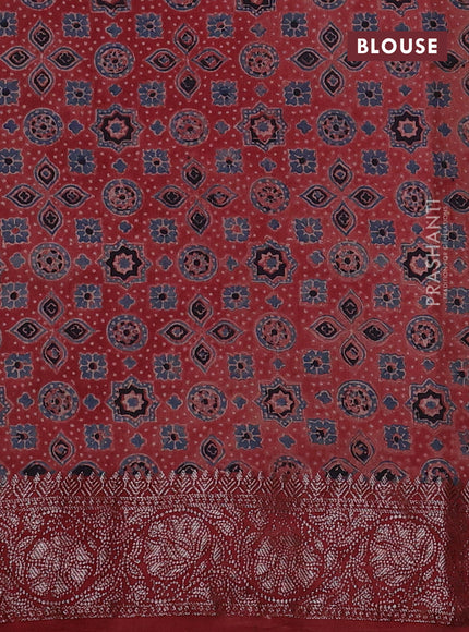 Chiniya silk saree green and maroon with plain body and woven border