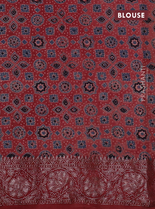 Chiniya silk saree green and maroon with plain body and woven border