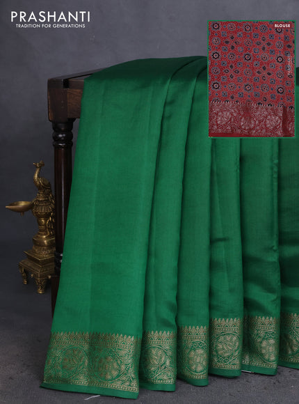 Chiniya silk saree green and maroon with plain body and woven border