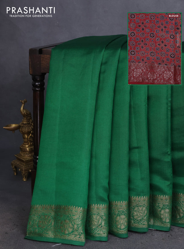 Chiniya silk saree green and maroon with plain body and woven border