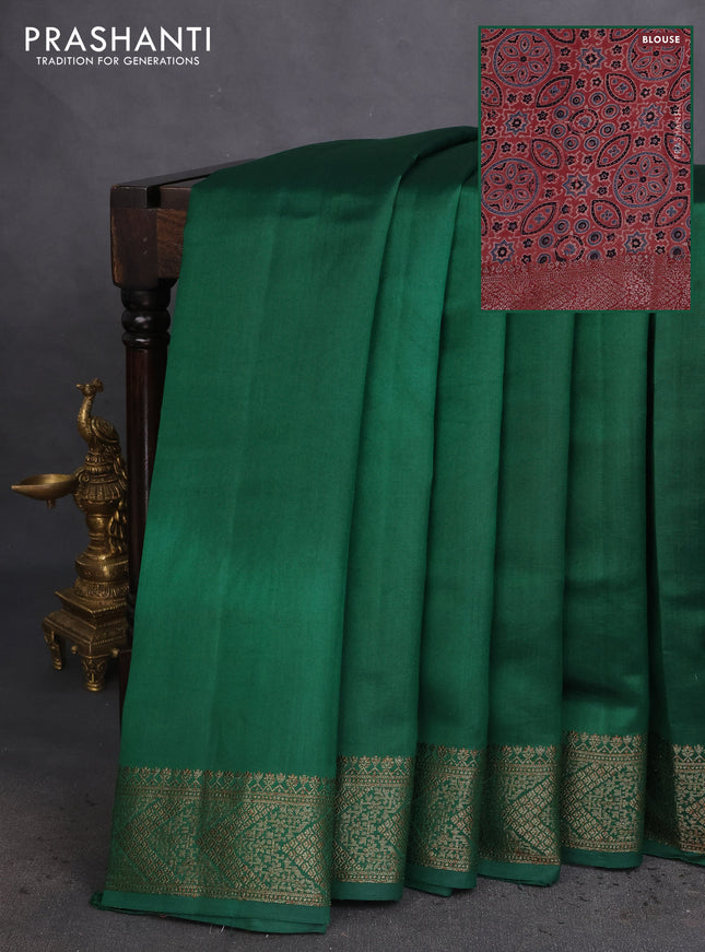Chiniya silk saree green and maroon with plain body and woven border