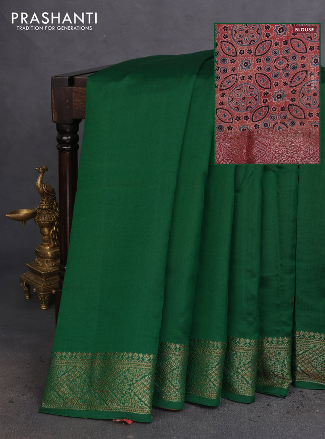 Chiniya silk saree green and maroon with plain body and woven border