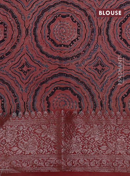 Chiniya silk saree green and rust shade with plain body and woven border