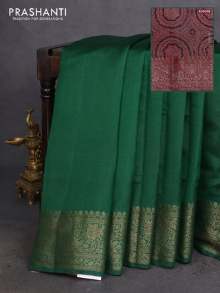 Chiniya silk saree green and rust shade with plain body and woven border