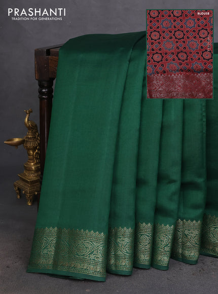 Chiniya silk saree green and maroon with plain body and woven border