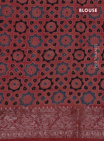 Chiniya silk saree black and maroon with plain body and woven border