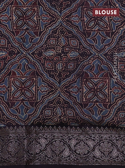 Chiniya silk saree wine shade and black with plain body and woven border