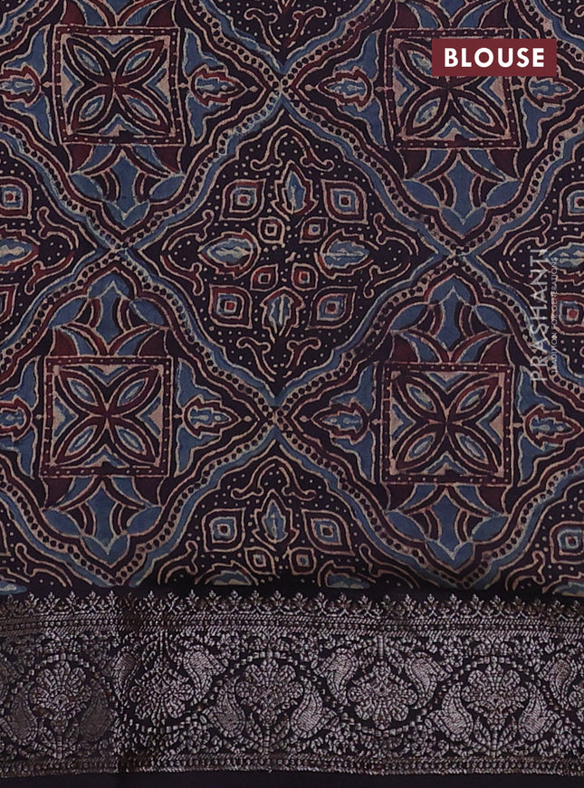 Chiniya silk saree wine shade and black with plain body and woven border