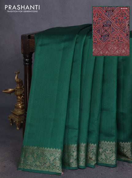 Chiniya silk saree green and rust shade with plain body and woven border