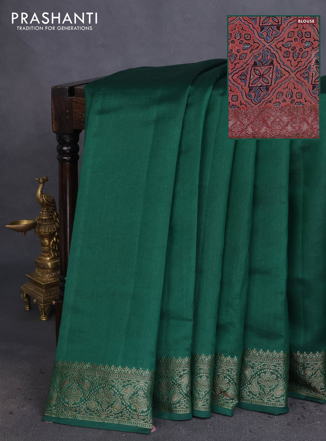 Chiniya silk saree green and rust shade with plain body and woven border