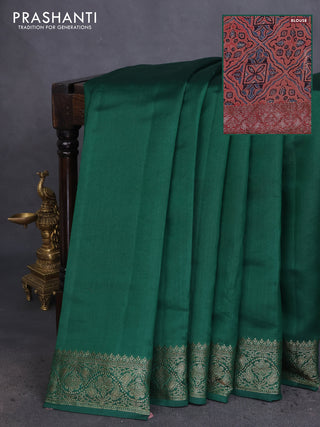 Chiniya silk saree green and rust shade with plain body and woven border