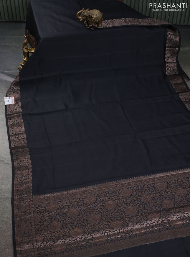 Chiniya silk saree black and rust shade with plain body and woven border