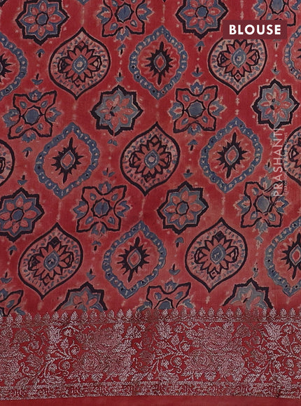 Chiniya silk saree black and rust shade with plain body and woven border