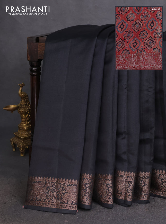 Chiniya silk saree black and rust shade with plain body and woven border