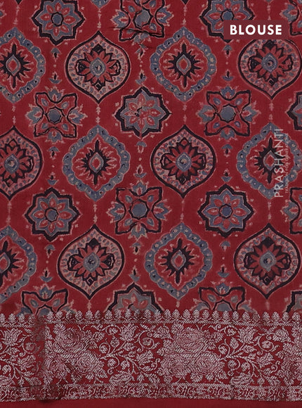 Chiniya silk saree green and maroon with plain body and woven border