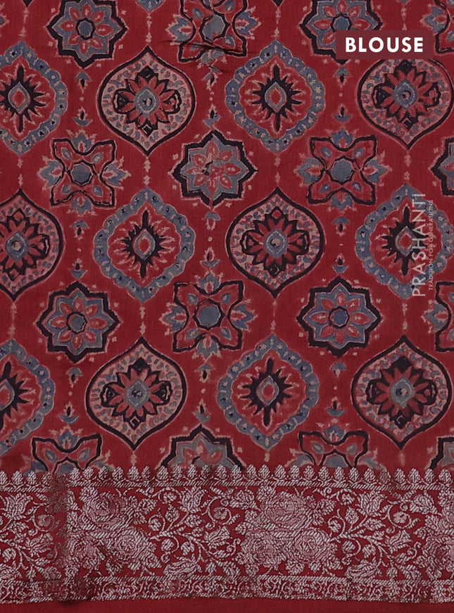 Chiniya silk saree green and maroon with plain body and woven border