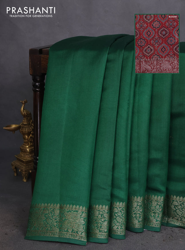 Chiniya silk saree green and maroon with plain body and woven border