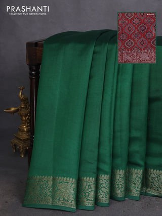 Chiniya silk saree green and maroon with plain body and woven border