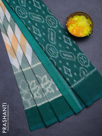 Ikat cotton saree off white and teal green with allover zig zag ikat weaves and simple border