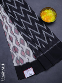 Ikat cotton saree off white and black with allover ikat butta weaves and simple border