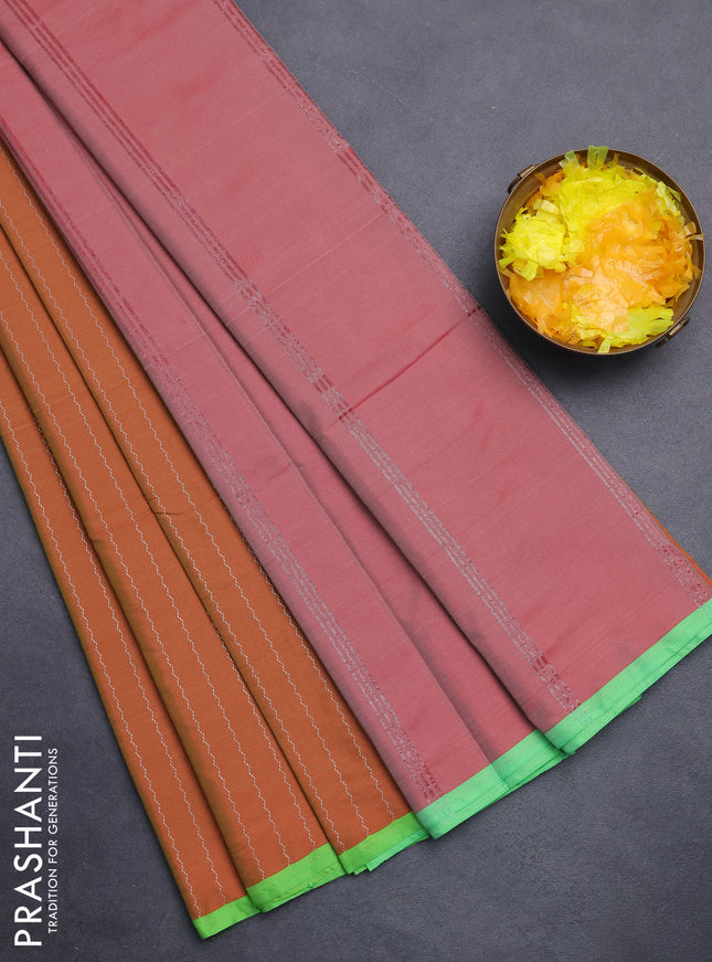 Arani semi silk saree rust shade and light green with allover silver zari weaves and piping border