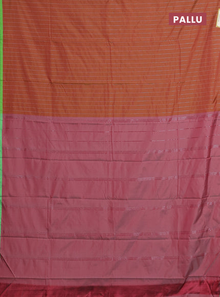 Arani semi silk saree rust shade and light green with allover silver zari weaves and piping border