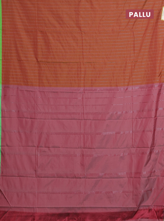Arani semi silk saree rust shade and light green with allover silver zari weaves and piping border