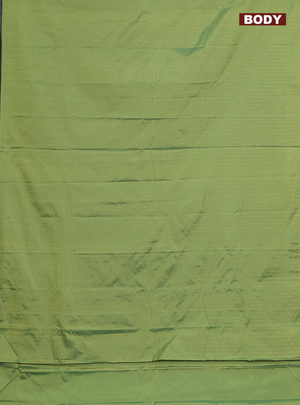 Arani semi silk saree light green with allover copper zari weaves in borderless style