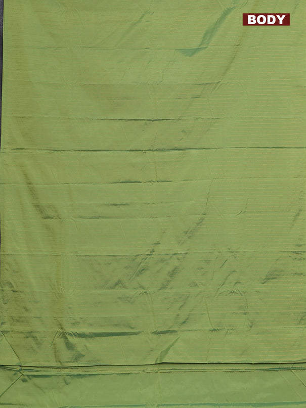 Arani semi silk saree light green with allover copper zari weaves in borderless style