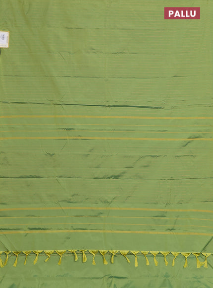 Arani semi silk saree light green with allover copper zari weaves in borderless style
