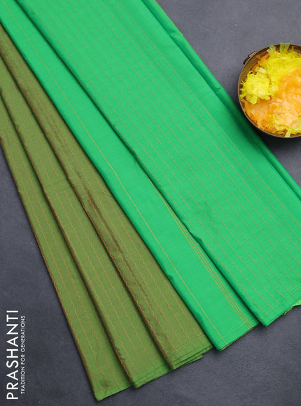 Arani semi silk saree green with allover copper zari weaves in borderless style