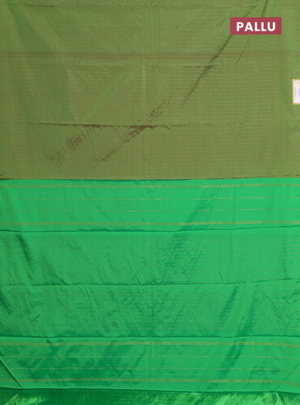 Arani semi silk saree green with allover copper zari weaves in borderless style