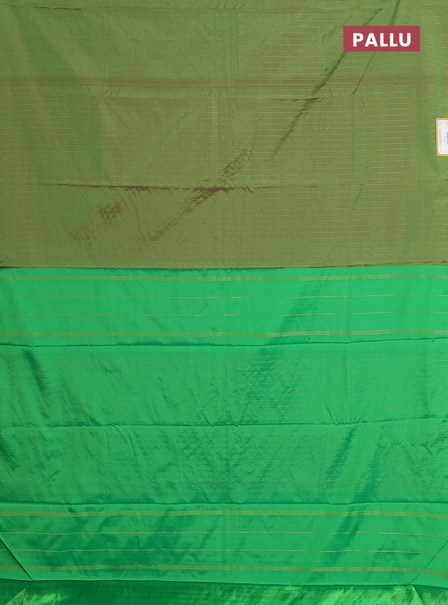 Arani semi silk saree green with allover copper zari weaves in borderless style