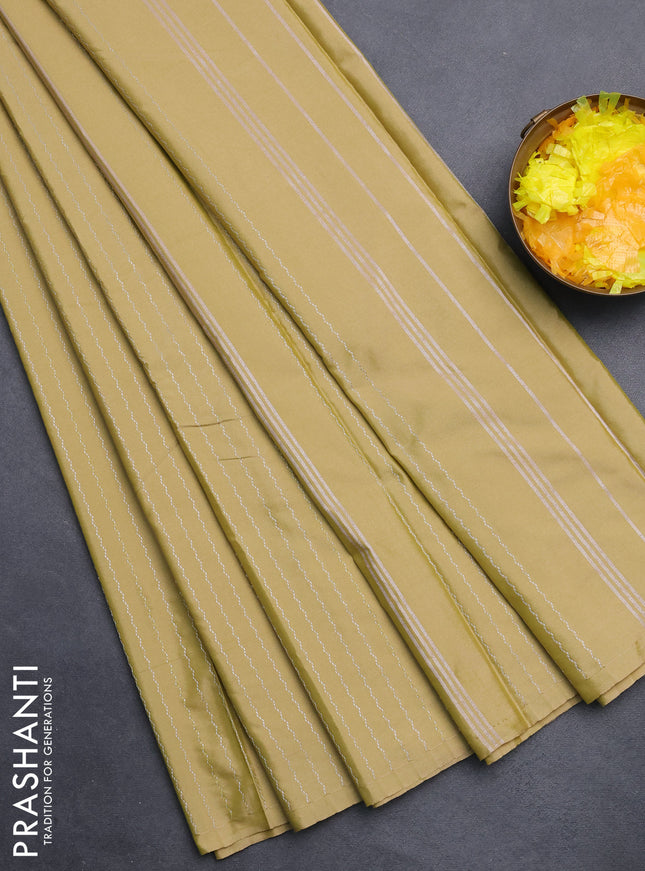 Arani semi silk saree elaichi green with allover silver zari weaves in borderless style