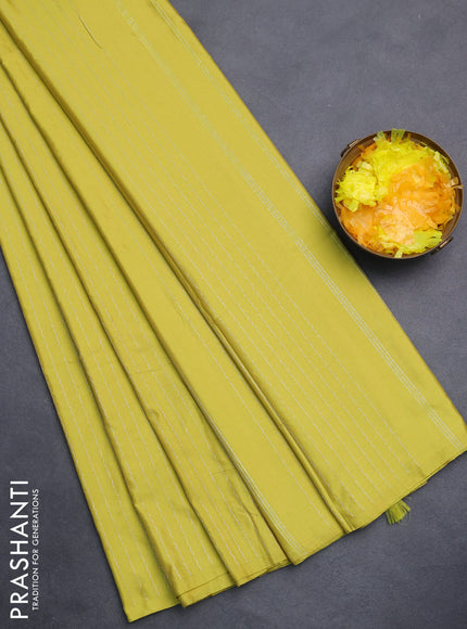 Arani semi silk saree lime yellow with allover silver zari weaves in borderless style