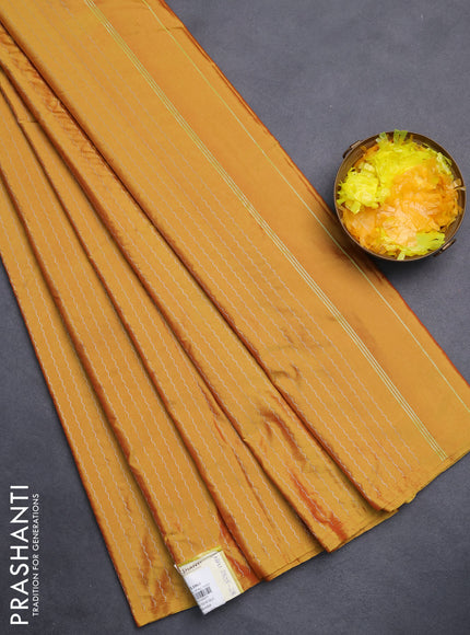 Arani semi silk saree mustard yellow with allover silver zari weaves in borderless style